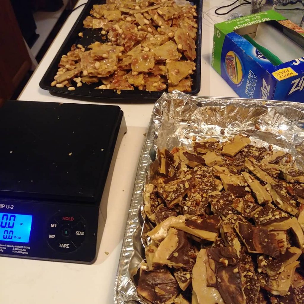 toffee and brittle in aluminum pans with a digital scale